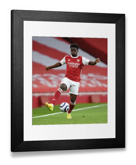 Framed Print : Arsenal's Bukayo Saka Shines in Empty Emirates Stadium: Arsenal vs. Tottenham, Premier League 2020-21