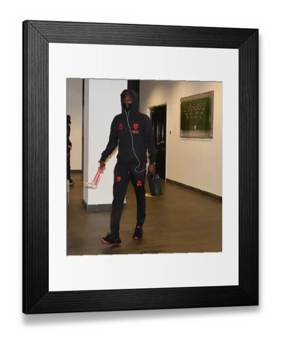Framed Print : Arsenal's Nicolas Pepe Arrives at Emptied Emirates Stadium Ahead of Arsenal v Tottenham Hotspur Premier League Clash (2021) Framed Print : Arsenal's Nicolas Pepe Arrives at Emptied Emirates Stadium Ahead of Arsenal v Tottenham Hotspur Premier League Clash (2021)