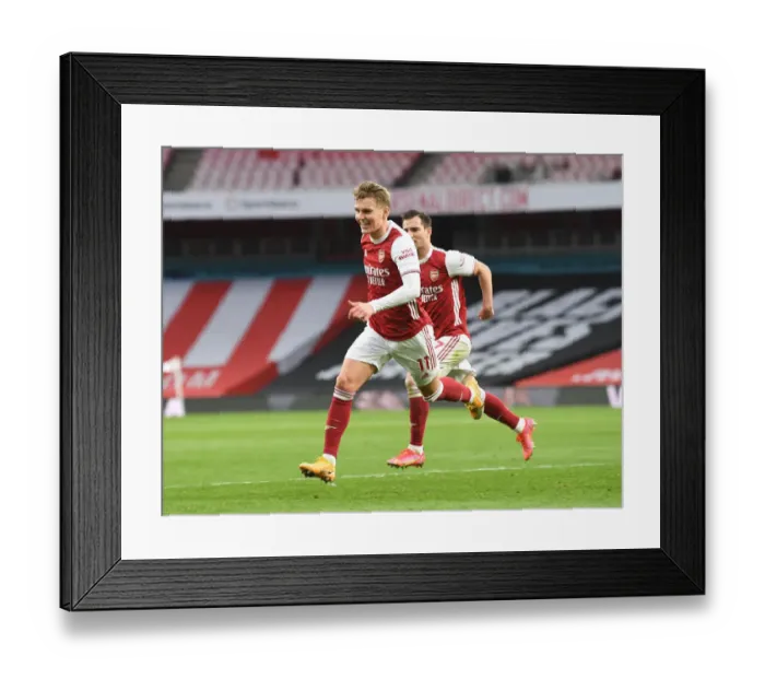 Framed Print : Martin Odegaard's Goal: Arsenal's Victory Over Tottenham Amidst Empty Emirates Stadium (2020-21)