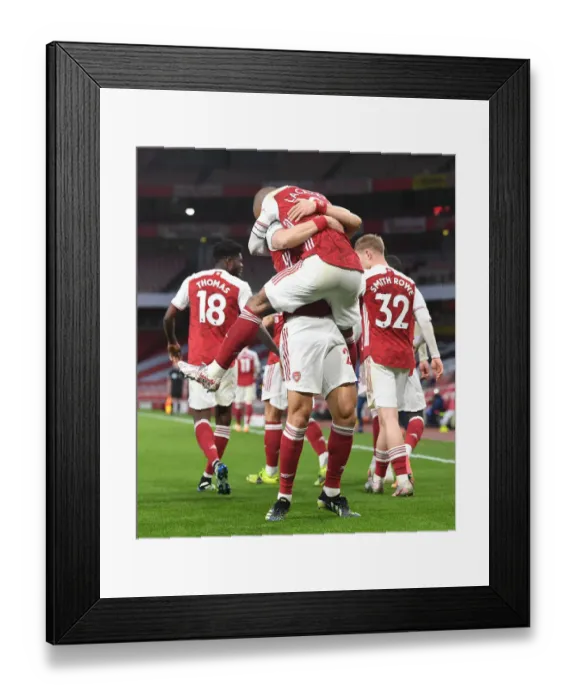 Framed Print : Empty Emirates: Lacazette and Luiz Celebrate Arsenal's Victory Over Tottenham (2020-21)