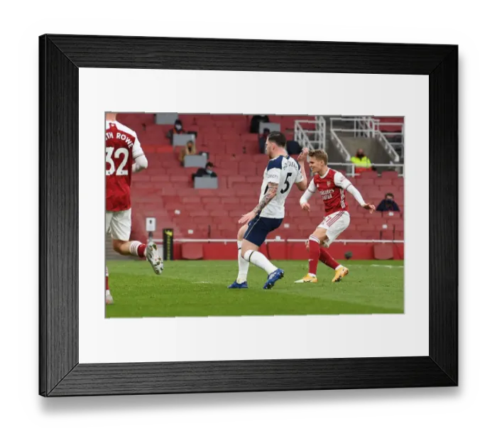 Framed Print : Martin Odegaard's Thrilling Winner: Arsenal Triumphs Over Tottenham in Epic Premier League Clash Framed Print : Martin Odegaard's Thrilling Winner: Arsenal Triumphs Over Tottenham in Epic Premier League Clash
