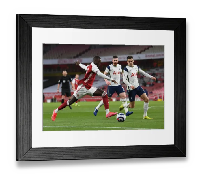 Framed Print : Arsenal vs. Tottenham: Pepe Faces Off Against Reguilon in Intense Premier League Clash Framed Print : Arsenal vs. Tottenham: Pepe Faces Off Against Reguilon in Intense Premier League Clash