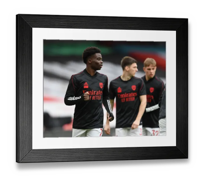 Framed Print : Bukayo Saka's Unwavering Focus: Arsenal vs. Tottenham Showdown