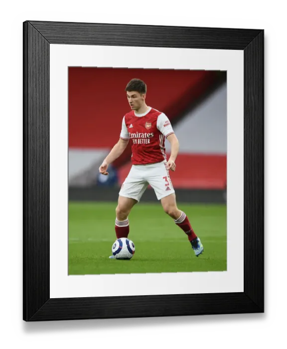 Framed Print : Arsenal's Kieran Tierney Clashes with Tottenham at the Emirates Stadium