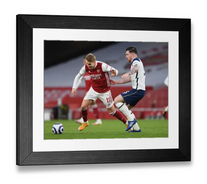 Framed Print : Arsenal vs. Tottenham: Martin Odegaard Clashes with Pierre-Emile Hojbjerg in Intense Premier League Showdown