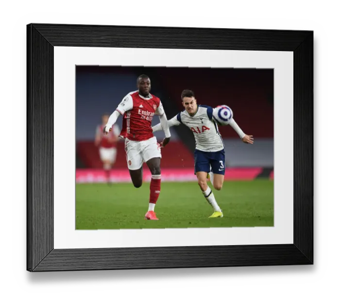 Framed Print : Arsenal vs. Tottenham: Pepe vs. Reguilon Battle in the Premier League