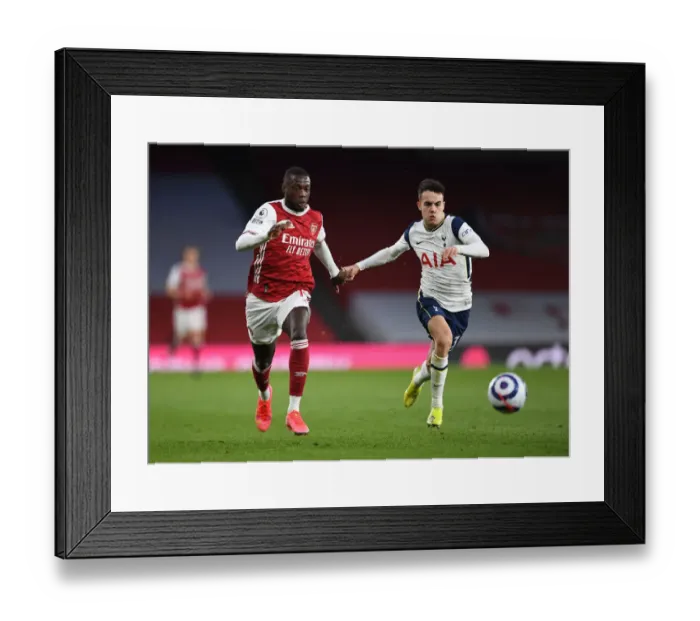 Framed Print : Pepe vs. Reguilon: A Winged Showdown in the Arsenal-Tottenham Rivalry Framed Print : Pepe vs. Reguilon: A Winged Showdown in the Arsenal-Tottenham Rivalry