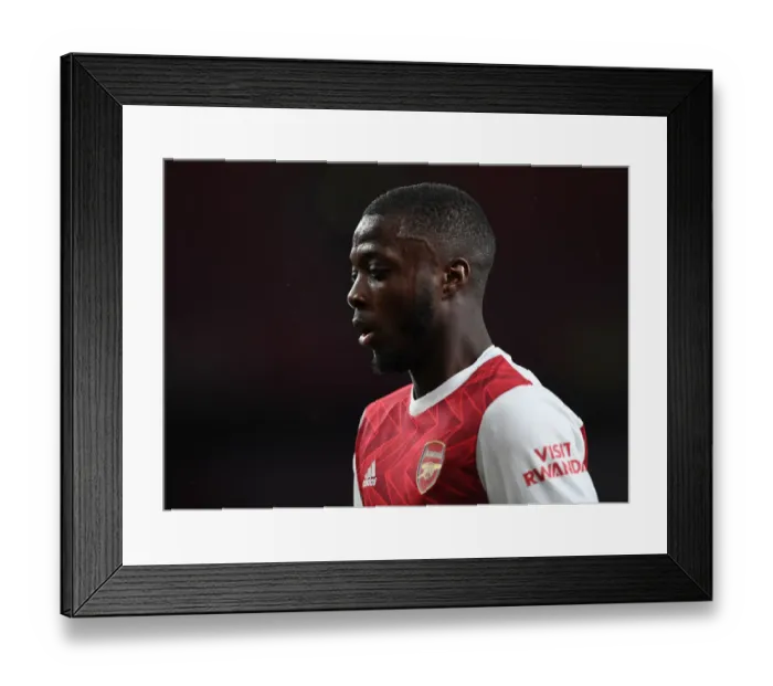Framed Print : Arsenal's Nicolas Pepe Faces Off Against Tottenham in Premier League Clash Framed Print : Arsenal's Nicolas Pepe Faces Off Against Tottenham in Premier League Clash