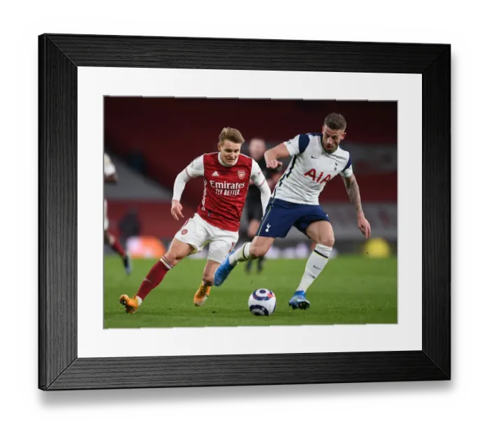 Framed Print : Arsenal vs. Tottenham: Martin Odegaard Closes In on Toby Alderweireld in Intense Premier League Clash Framed Print : Arsenal vs. Tottenham: Martin Odegaard Closes In on Toby Alderweireld in Intense Premier League Clash