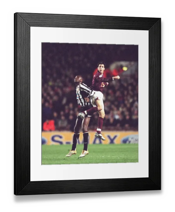 Framed Print : Arsenal's Young Star Cesc Fabregas Outshines Veteran Patrick Vieira in Champions League Clash against Juventus