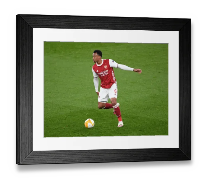 Framed Print : Arsenal's Gabriel Magalhaes in UEFA Europa League Action vs Olympiacos (Behind Closed Doors)