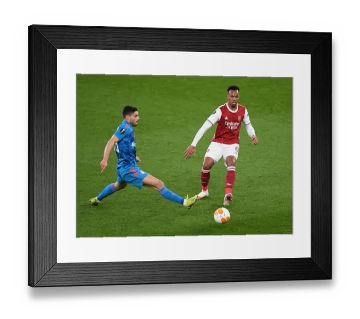 Framed Print : Arsenal vs. Olympiacos: Gabriel Magalhaes Faces Pressure in Empty Emirates Stadium - UEFA Europa League Round of 16