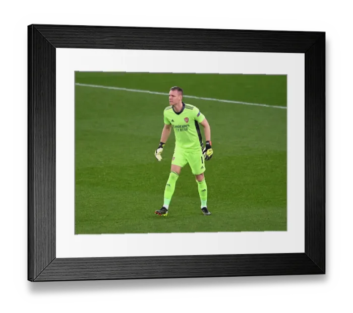 Framed Print : Bernd Leno: Arsenal's Solo Guardian in an Empty Emirates Stadium during the Europa League Match against Olympiacos (2020-21)
