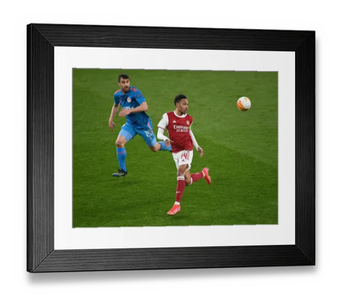 Framed Print : Arsenal's Aubameyang Faces Off Against Olympiacos in Empty Emirates: Europa League Clash Amidst Pandemic Framed Print : Arsenal's Aubameyang Faces Off Against Olympiacos in Empty Emirates: Europa League Clash Amidst Pandemic