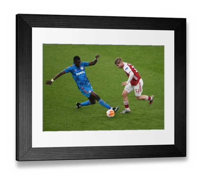 Framed Print : Emile Smith Rowe's Europa League Showdown: Arsenal vs Olympiacos at Empty Emirates Stadium, London, 2021 Framed Print : Emile Smith Rowe's Europa League Showdown: Arsenal vs Olympiacos at Empty Emirates Stadium, London, 2021