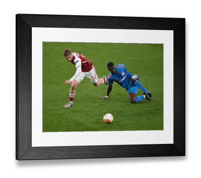 Framed Print : Emile Smith Rowe's Europa League Battle: Arsenal vs. Olympiacos at Empty Emirates Stadium, London, 2021 Framed Print : Emile Smith Rowe's Europa League Battle: Arsenal vs. Olympiacos at Empty Emirates Stadium, London, 2021