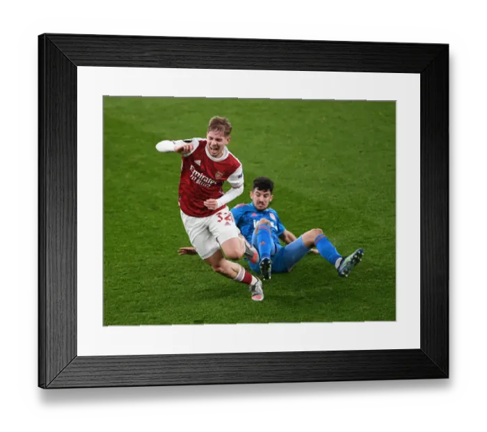 Framed Print : Emile Smith Rowe's Europa League Battle: Arsenal vs Olympiacos in Empty Emirates Stadium
