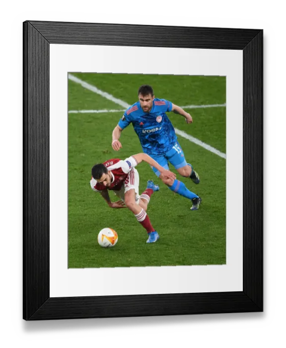 Framed Print : Arsenal vs Olympiacos: Emirates Stadium Battle in Empty Europa League Arena Framed Print : Arsenal vs Olympiacos: Emirates Stadium Battle in Empty Europa League Arena
