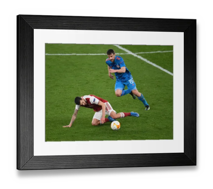 Framed Print : Empty Battle: Dani Ceballos vs Sokratis in Arsenal's Europa League Clash Against Olympiacos