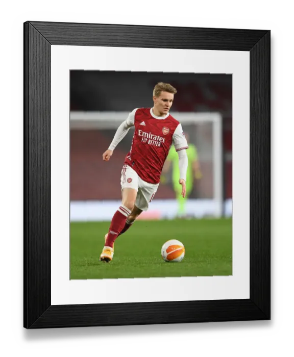 Framed Print : Odegaard's Shining Performance in Empty Emirates: Arsenal's Europa League Battle against Olympiacos