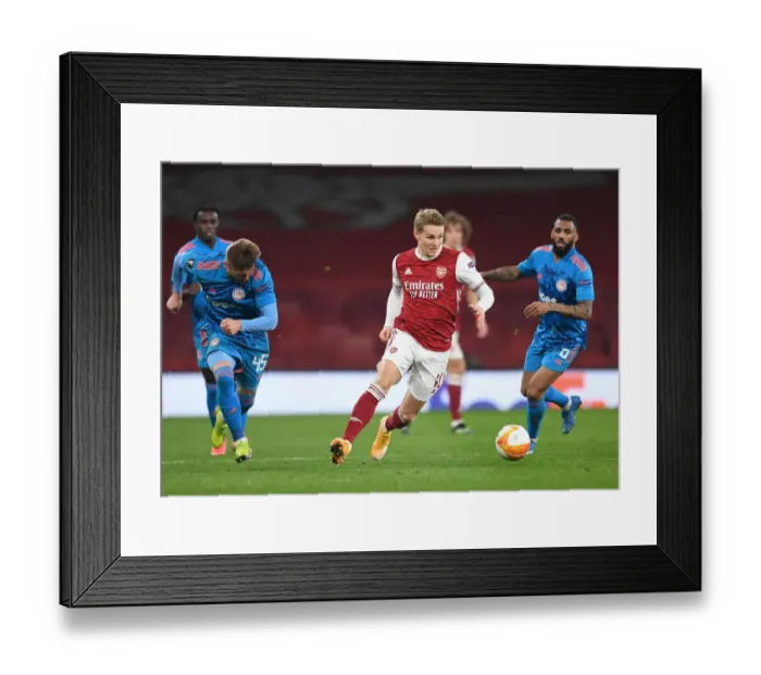 Framed Print : Arsenal's Martin Odegaard in Europa League Action vs Olympiacos (Behind Closed Doors) Framed Print : Arsenal's Martin Odegaard in Europa League Action vs Olympiacos (Behind Closed Doors)