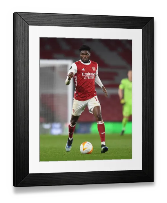 Framed Print : LONDON, ENGLAND - MARCH 18: Thomas Partey of Arsenal during the UEFA Europa League Round of 16 Second Leg match between