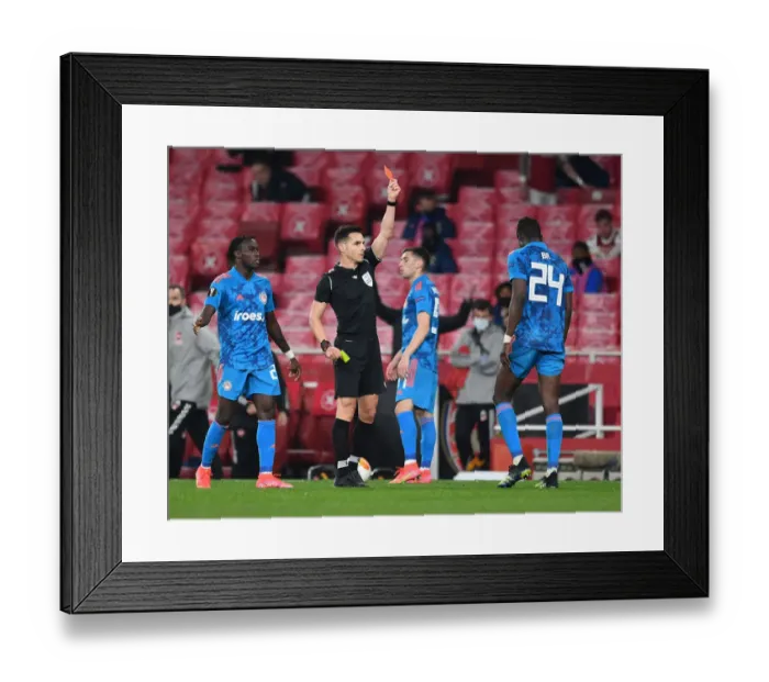 Framed Print : Arsenal's Europa League Clash with Olympiacos Marred by Red Cards: Del Cerro Grande Dishes Out Punishments Amid Empty Emirates Stadium