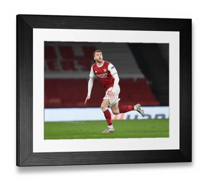 Framed Print : Arsenal vs Olympiacos: Empty Emirates Stadium in Europa League Amidst Pandemic Restrictions