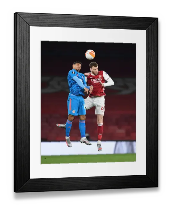 Framed Print : Arsenal vs. Olympiacos: Calum Chambers Heads the Ball in Empty Emirates Stadium - UEFA Europa League Round of 16 Framed Print : Arsenal vs. Olympiacos: Calum Chambers Heads the Ball in Empty Emirates Stadium - UEFA Europa League Round of 16