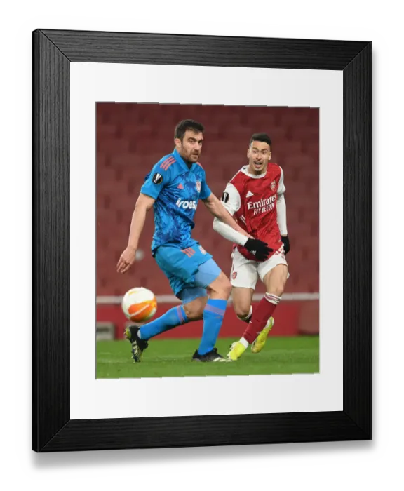 Framed Print : Martinelli's Empty Emirates Cross: Arsenal vs Olympiacos Europa League Showdown (2020-21)