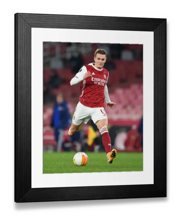 Framed Print : Arsenal's Odegaard Shines in Empty Emirates: UEFA Europa League Clash Against Olympiacos