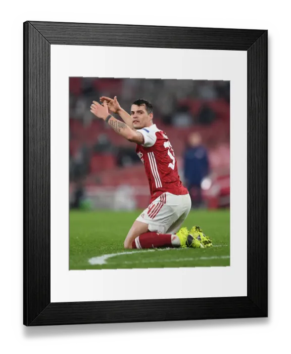 Framed Print : Behind Closed Doors: Granit Xhaka's Europa League Battle with Olympiacos (Arsenal, 2021) Framed Print : Behind Closed Doors: Granit Xhaka's Europa League Battle with Olympiacos (Arsenal, 2021)