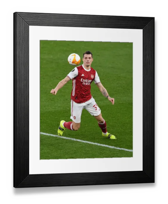 Framed Print : Arsenal's Granit Xhaka in Europa League Action Against Olympiacos Amid Empty Emirates Stadium