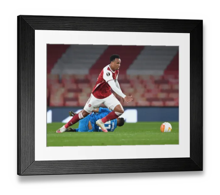 Framed Print : Arsenal's Gabriel in Europa League Action: Arsenal vs. Olympiacos (Behind Closed Doors)