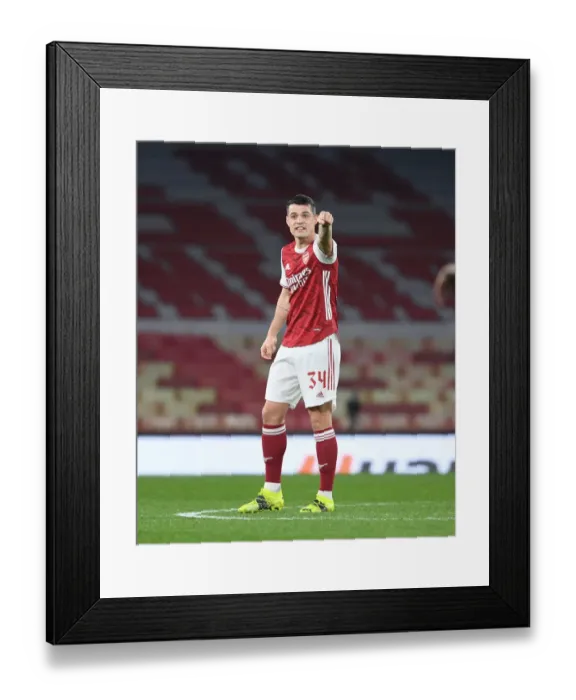 Framed Print : Arsenal's Granit Xhaka in UEFA Europa League: A Lone Warrior at Emirates Stadium Amidst Empty Seats (Arsenal vs. Olympiacos, 2021) Framed Print : Arsenal's Granit Xhaka in UEFA Europa League: A Lone Warrior at Emirates Stadium Amidst Empty Seats (Arsenal vs. Olympiacos, 2021)