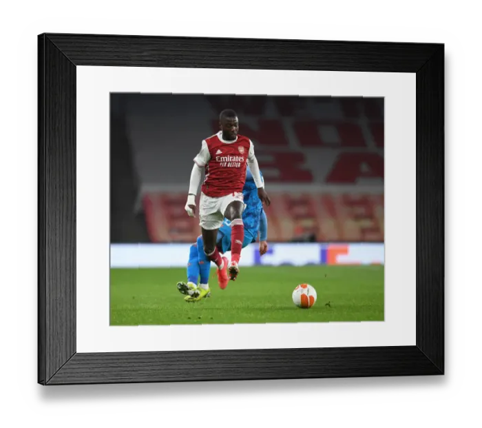 Framed Print : Arsenal's Nicolas Pepe in UEFA Europa League Action against Olympiacos (Behind Closed Doors) Framed Print : Arsenal's Nicolas Pepe in UEFA Europa League Action against Olympiacos (Behind Closed Doors)