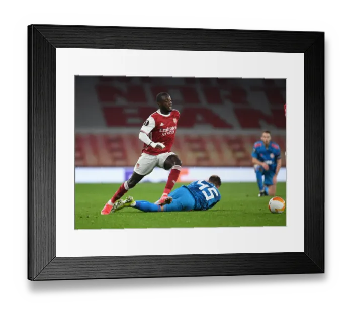 Framed Print : Arsenal's Nicolas Pepe Scores in Empty Emirates Stadium: UEFA Europa League 2021