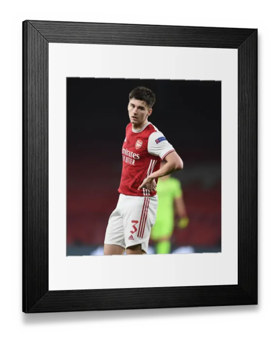 Framed Print : Lone Warrior Tierney: Arsenal's Hero in Empty Europa League Arena vs Olympiacos