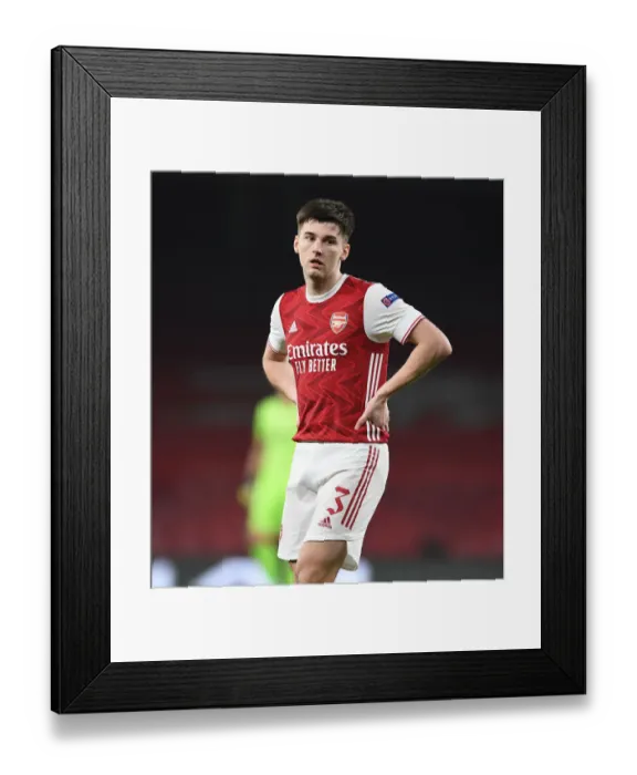 Framed Print : Arsenal's Kieran Tierney in Europa League: A Closed-Doors Battle Against Olympiacos Framed Print : Arsenal's Kieran Tierney in Europa League: A Closed-Doors Battle Against Olympiacos