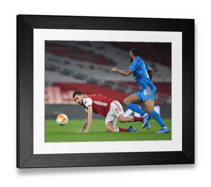 Framed Print : Arsenal vs Olympiacos: Empty Emirates Stadium Clash in Europa League Round of 16