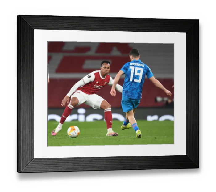Framed Print : Arsenal vs Olympiacos: Gabriel Clashes in Empty Emirates Stadium - UEFA Europa League Round of 16, 2021