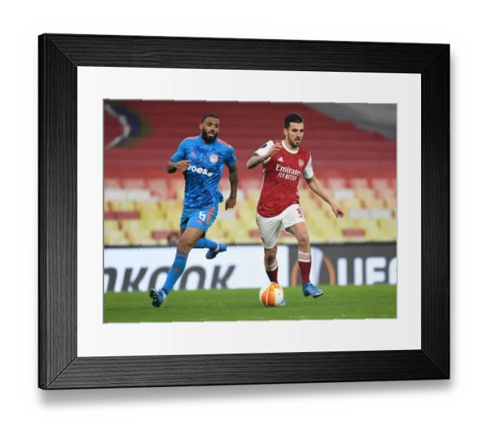 Framed Print : Arsenal's Dani Ceballos Breaks Past Olympiacos Defense in Empty Europa League Match