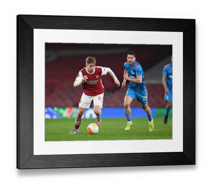 Framed Print : Arsenal's Emile Smith Rowe Breaks Past Olympiacos Giorgos Masouras in Empty Emirates Stadium - UEFA Europa League Round of 16