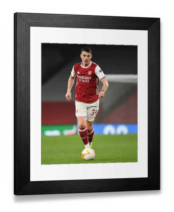 Framed Print : Arsenal's Granit Xhaka in UEFA Europa League Action Against Olympiacos (Behind Closed Doors)