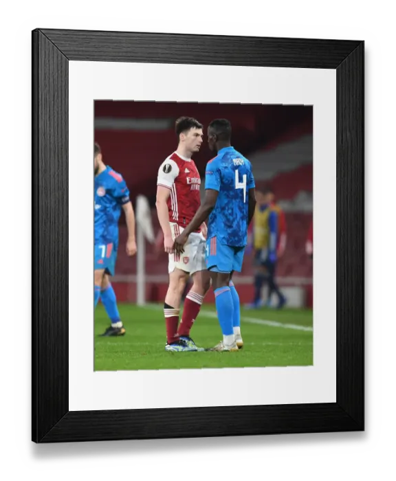 Framed Print : Arsenal vs Olympiacos: Tierney Clashes in Empty Europa League Match, London, 2021 Framed Print : Arsenal vs Olympiacos: Tierney Clashes in Empty Europa League Match, London, 2021