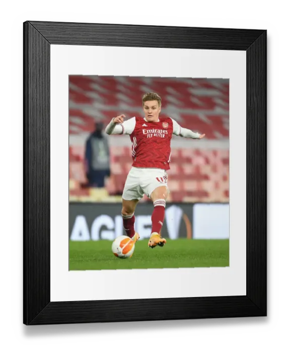 Framed Print : Behind Closed Doors: Martin Odegaard in Europa League Action for Arsenal Against Olympiacos Framed Print : Behind Closed Doors: Martin Odegaard in Europa League Action for Arsenal Against Olympiacos