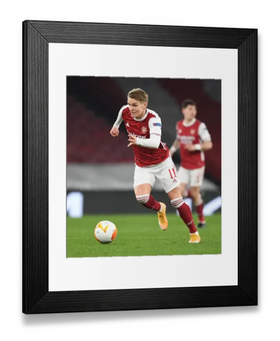 Framed Print : Arsenal's Odegaard Plays in Empty Emirates Against Olympiacos, UEFA Europa League 2020-21