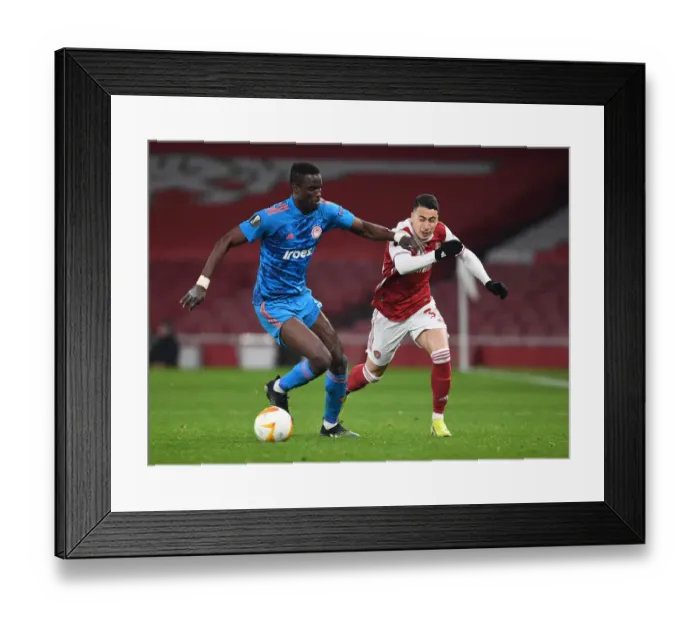 Framed Print : Arsenal vs. Olympiacos: Martinelli Fouls Marred Europa League Clash Amid Empty Emirates Stadium