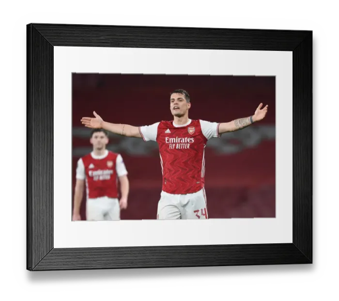 Framed Print : Arsenal's Granit Xhaka in Europa League Action vs Olympiacos (Behind Closed Doors)