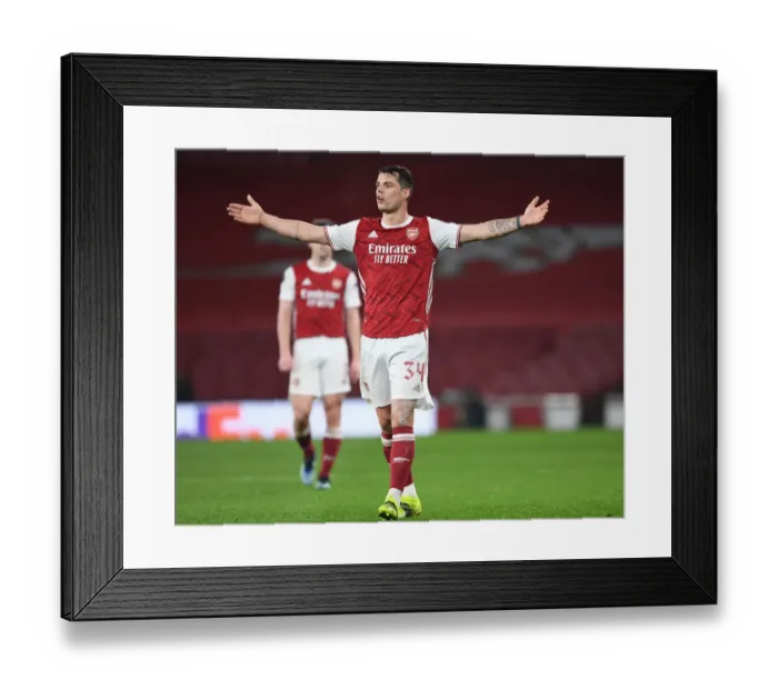 Framed Print : Granit Xhaka in UEFA Europa League Action: Arsenal vs. Olympiacos (Behind Closed Doors, 2021)